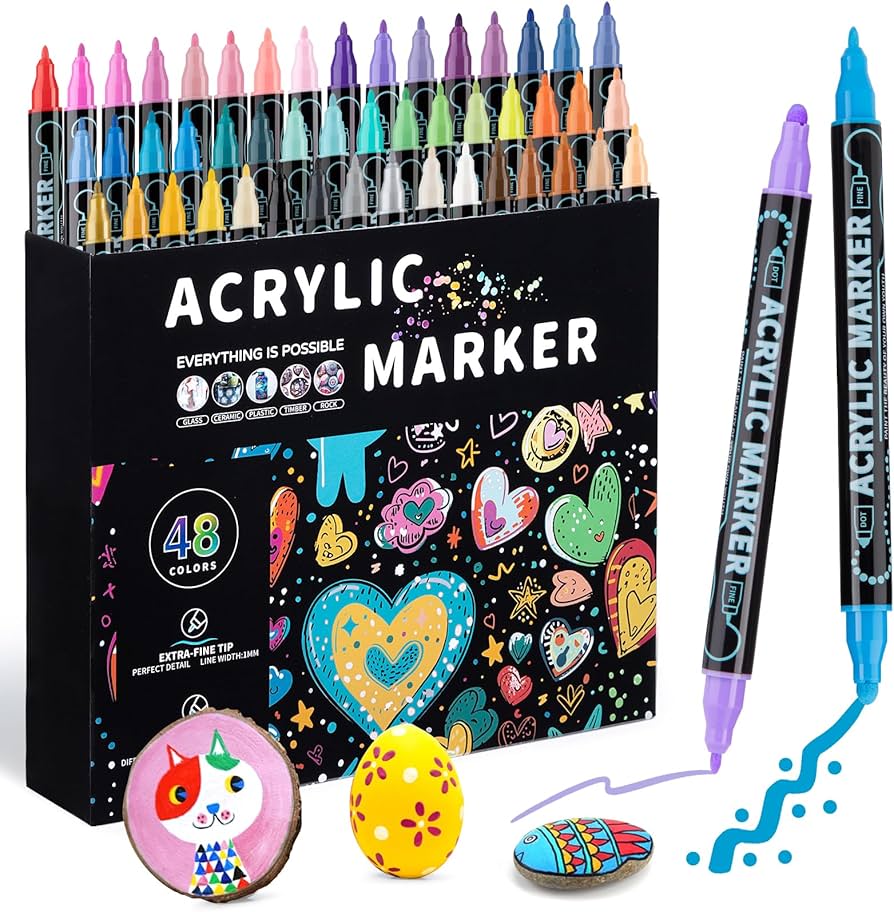 Malowanie liści markerem akrylowym zielonym Ręce trzymające zielony marker akrylowy wypełniający liście na kamieniu